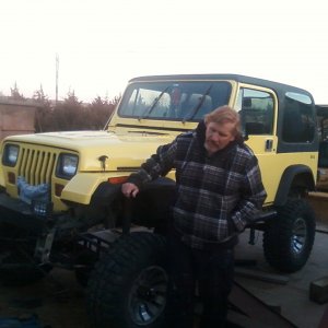 my pops standing next to my jeep he